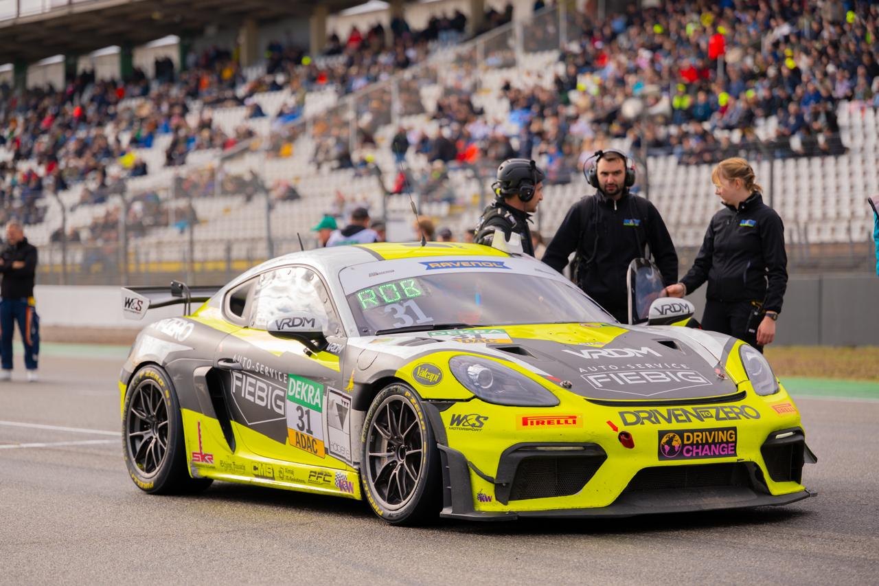 Sia next to the W&S Motorsport Porsche GT4 on the grid at Hockenheim
