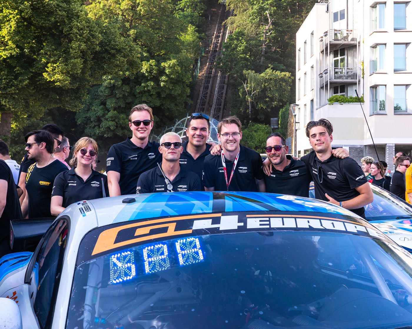 The JW Raceservice team behind their GT4 car at Spa